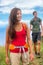 Happy woman hiker hiking couple in nature on hike trail on summer travel vacations. Healthy lifestyle young Asian girl