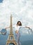 Happy woman hold shopping bag. successful shopping. sense of freedom. parisian girl travel to france. eiffel tower