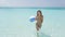 Happy Woman Holding Beach Ball Running In Water On Travel Vacation Holidays
