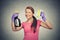 Happy woman holding brush and detergent cleaning solution bottle
