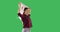Happy woman holding a Japanese flag and dancing on chroma key green screen.