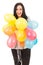 Happy woman holding many balloons