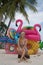 Happy woman with inflatable toys on the beach