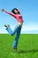 Happy woman jump in field