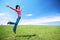 Happy woman jump in field