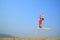 Happy Woman Jumping with blue sky outdoor on relaxing day
