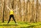 Happy woman jumping in spring nature