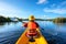 Happy woman kayaking with kayak boat in nuture lake behind sea and beach before sunset time for relax and extreme water sport