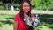 Happy woman laughing while holding flowers