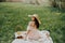 Happy Woman Life Style, beautiful relaxed girl in a straw hat on the nature picnic basket