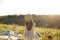 Happy woman lifestyle, beautiful relaxed girl in a straw hat on the nature from the back on picnic - camping