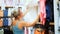 Happy woman looking at clothing in shopping center clothing store mall. Female shopper enjoying purchase in branded