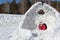 Happy woman lying at the entrance in unfinished an igloo