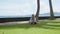 Happy woman makes yoga practice and stretch down forward to the legs on the ocean beach, beautiful background and nature sounds