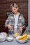 happy woman mashing up bananas and dough to bake cookies at home