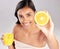 Happy woman, orange juice and fruit in portrait, health and nutrition with healthy drink and diet on studio background