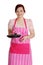 Happy woman in pink kitchen apron.