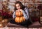 Happy woman and pumpkin. Young beautiful woman in autumn. Portrait of happy woman with a pumpkin