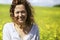 Happy woman in rapeseed field