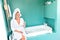 Happy woman relaxing bathroom spa wellbeing hotel