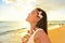 Happy woman relaxing on Hawaii beach vacation