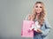 Happy woman shopping. Beauty girl with shopping bags