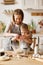 Happy woman and son cooking together in kitchen