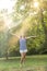 Happy woman spraying herself with water