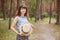 Happy woman with straw boater hat smile in countryside village on nature