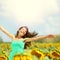 Happy woman in sunflower field