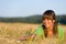 Happy woman in sunset corn field enjoy sun