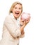 Happy woman, surprise and piggy bank for money savings or investment isolated on a white studio background. Portrait of