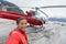 Happy woman taking selfie on helicopter excursion