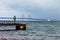 Happy woman tourist posing on the Oresund Bridge background.