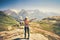 Happy Woman Traveler hands raised hiking