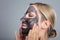 Happy Woman Using Activated Charcoal Face Mask