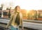 Happy woman walking in platform after arriving to destination.