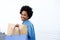 Happy woman walking with shopping on sidewalk