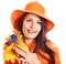 Happy woman wearing orange hat with flower.
