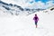 Happy woman winter trail running in beautiful inspirational land
