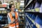 happy woman worker engineer technician staff work in factory products parts inventory warehouse storage using barcode scanner to