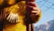 Happy woman wrings clothes on rope against blue sky closeup