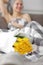 happy woman with yellow tulip flowers in bed after shower with towel on head enjoying romantic gift for valentines day