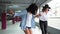 Happy Women Having Fun And Skateboarding At Parking