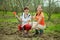 Happy women planting fruit tree