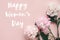 Happy Women`s Day text sign on stylish peonies flat lay. Pink and white peonies on pastel pink paper. Stylish floral greeting car