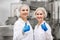 Happy women technologists at ice cream factory