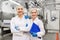 Happy women technologists at ice cream factory