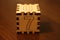 Happy wooden cube with figure seven.