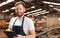 Happy worker looking at camera portrait at warehouse